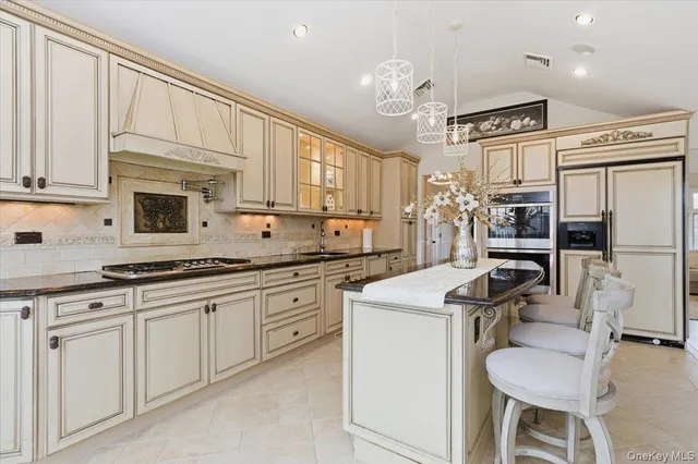 a kitchen with cabinets a sink and appliances