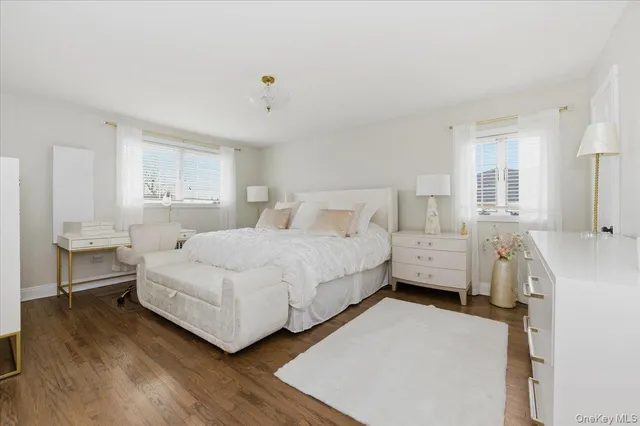 a bedroom with a bed and a table