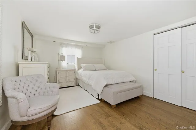 a bedroom with a bed and a couch