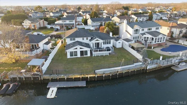 an aerial view of a house with a ocean view
