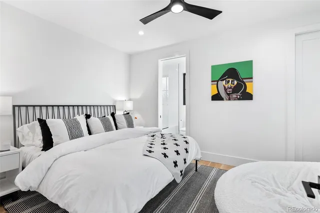 a bathroom with a sink toilet a mirror and shower