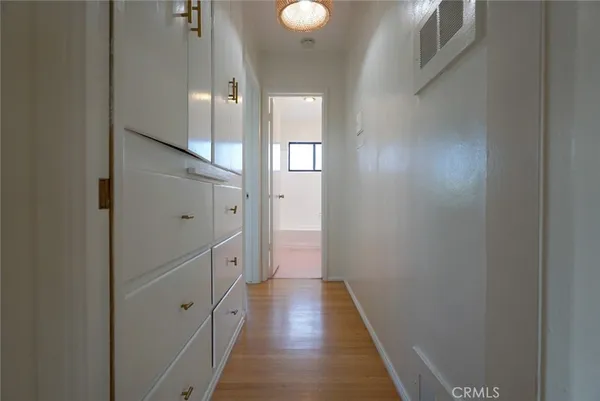 a view of a small space with wooden floor