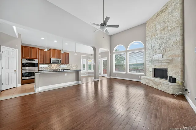 a view of a kitchen with wooden floor and a kitchen