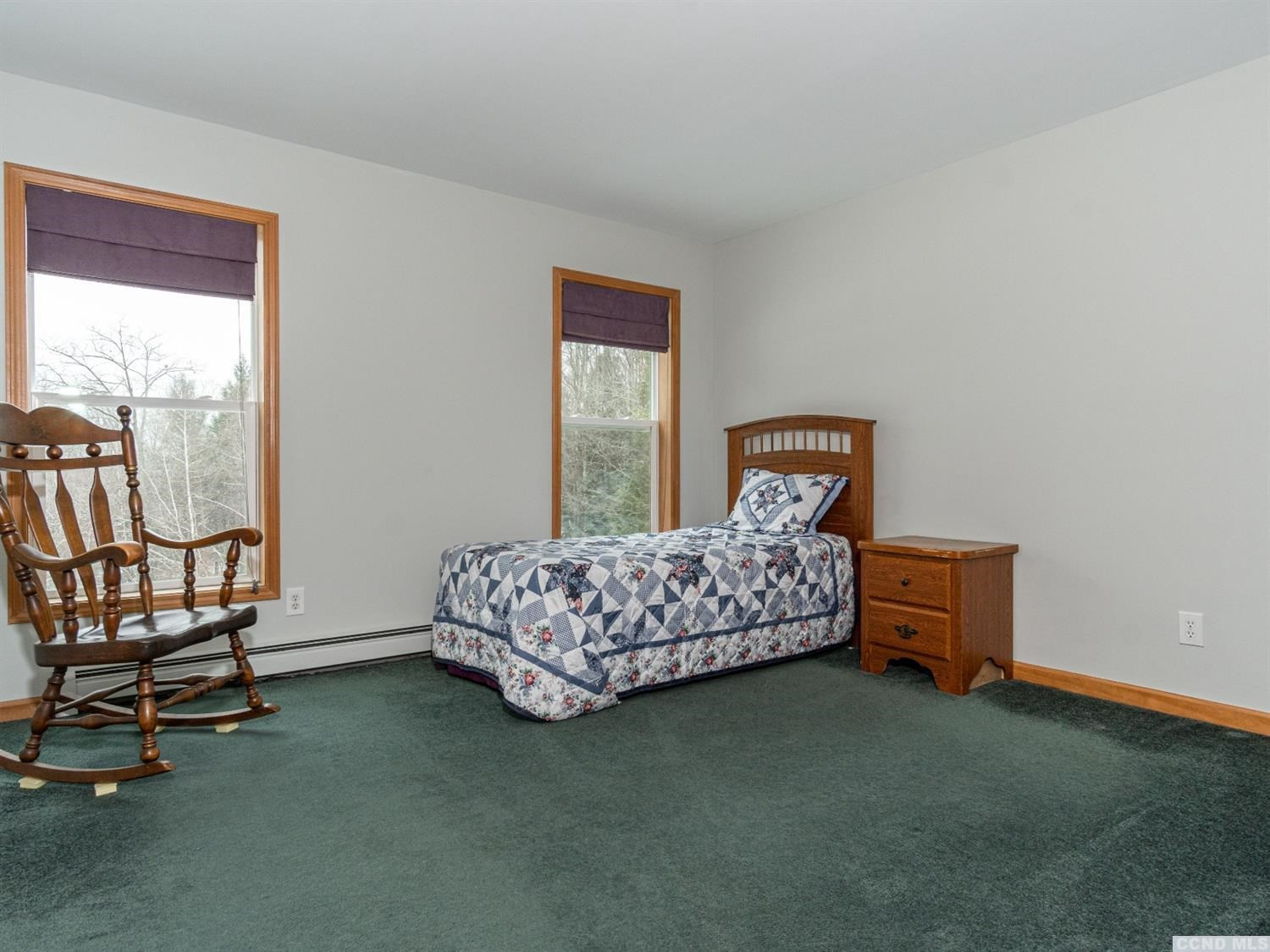 430 Momrow Road Sand Lake, NY 12153 - Photo 10 of 24 a bedroom with a bed chair and window