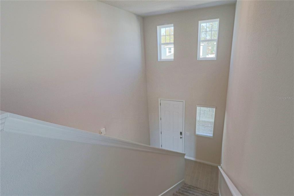 902 Rivers Crossing Street Clermont, FL 34714 - Photo 11 of 26 an empty room with windows