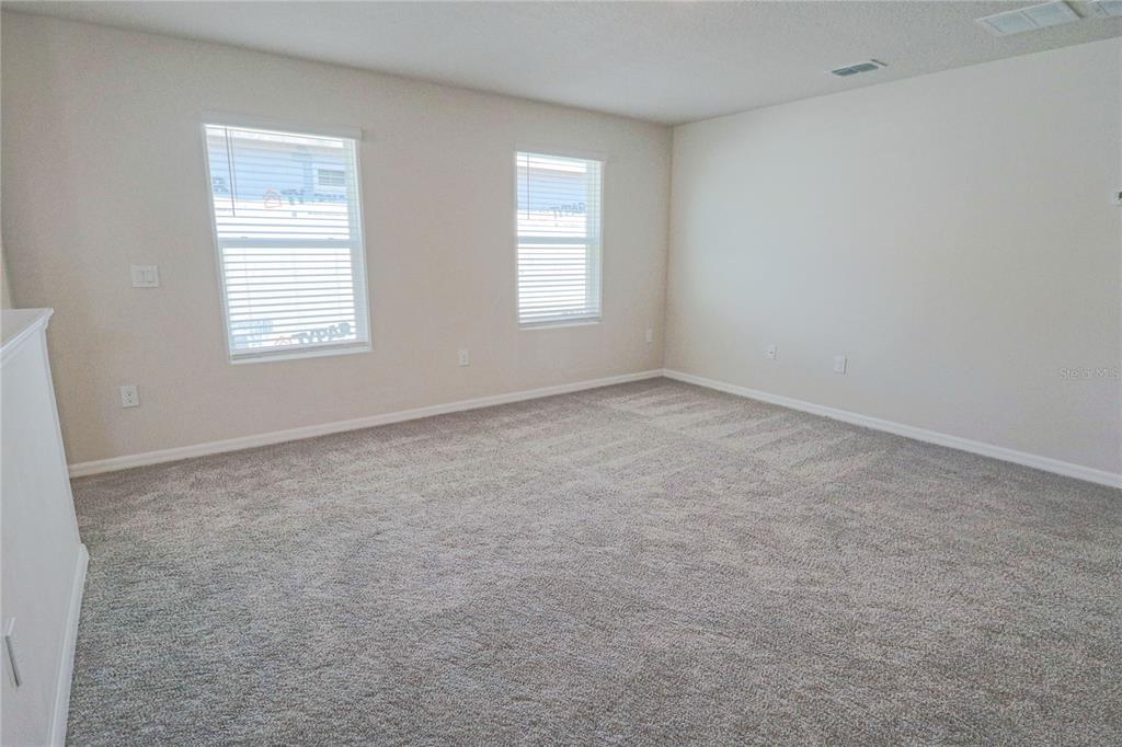 902 Rivers Crossing Street Clermont, FL 34714 - Photo 12 of 26 an empty room with windows