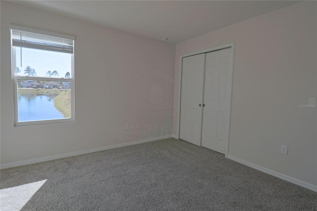 902 Rivers Crossing Street Clermont, FL 34714 - Photo 16 of 26 a view of an empty room with a window