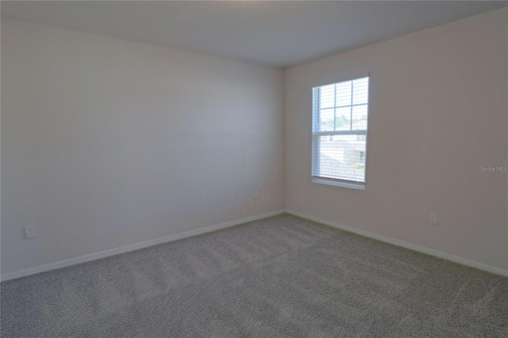 902 Rivers Crossing Street Clermont, FL 34714 - Photo 17 of 26 an empty room with a window