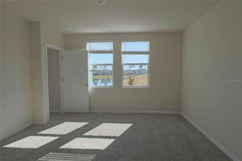 902 Rivers Crossing Street Clermont, FL 34714 - Photo 6 of 26 an empty room with windows