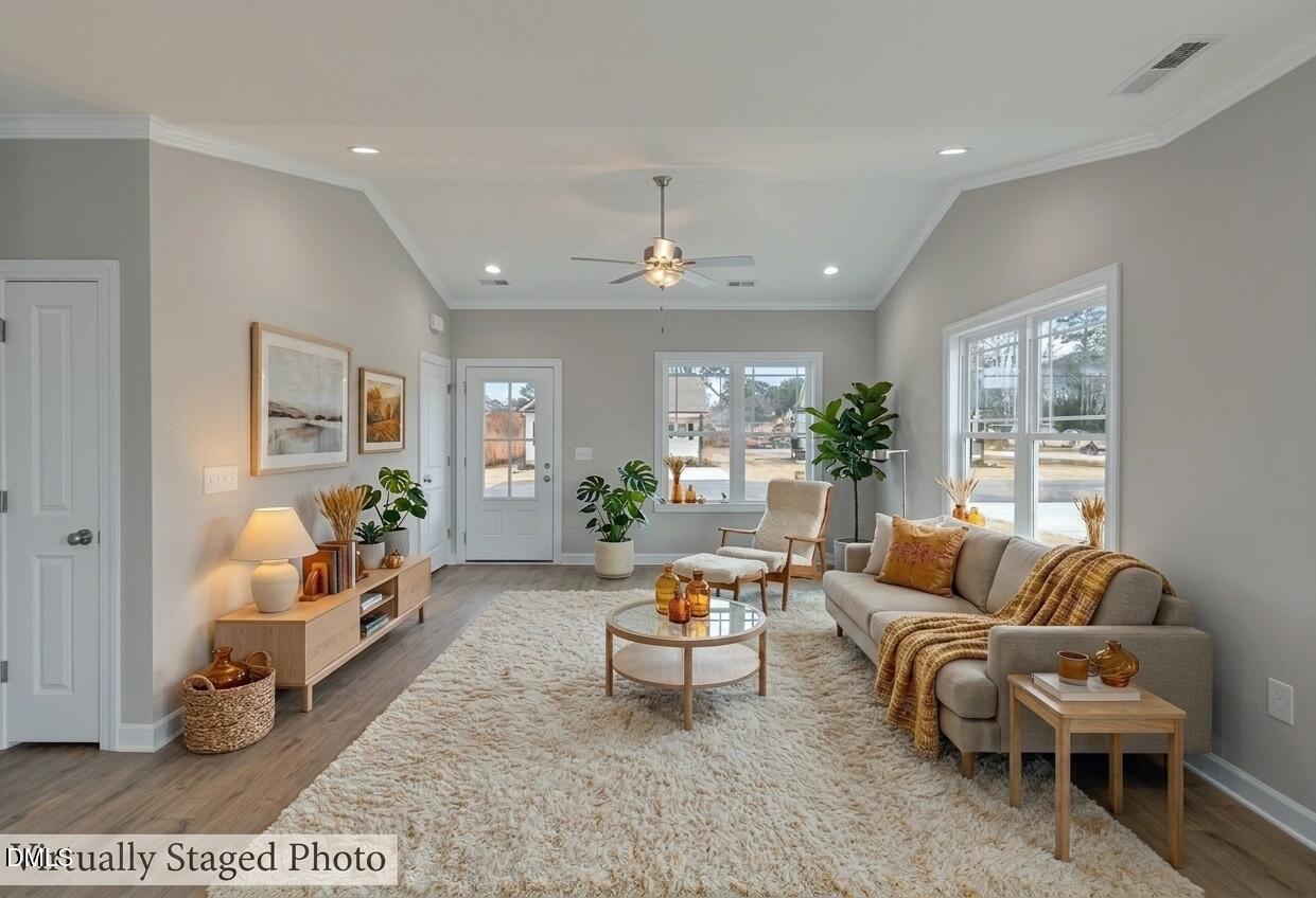 926 Micro Road West Selma, NC 27576 - Photo 12 of 41 a living room with furniture and a large window