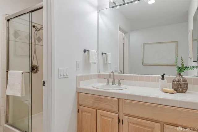 a bed room with a bed and a potted plant