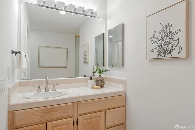 a bedroom with a bed and a lamp