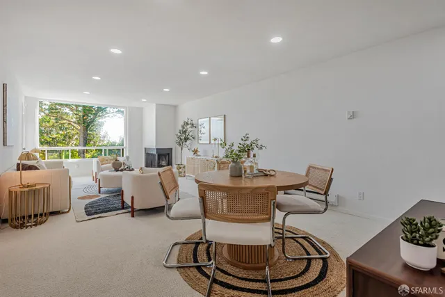 a view of a livingroom with furniture and a window