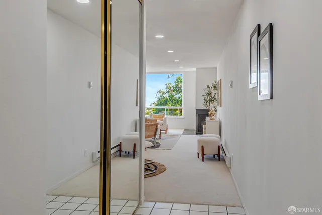 a kitchen with granite countertop wooden cabinets stainless steel appliances and a counter space