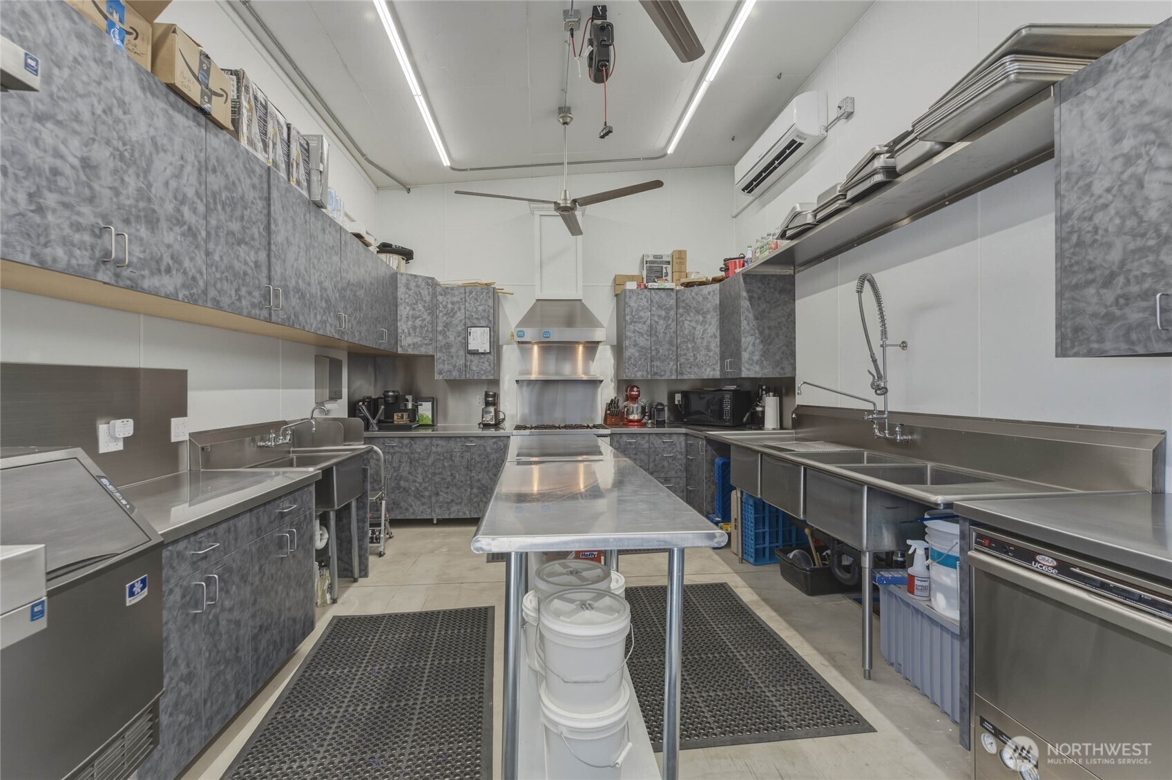 117 Freese Road Quincy, WA 98848 - Photo 27 of 40 a kitchen with stainless steel appliances granite countertop a sink a stove and cabinets