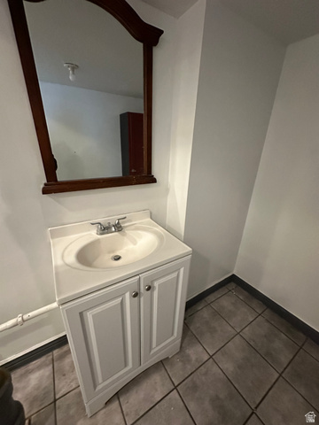 8320 West 3100th Street South Magna, UT 84044 - Photo 22 of 41 Bathroom featuring vanity and dark tile patterned floors