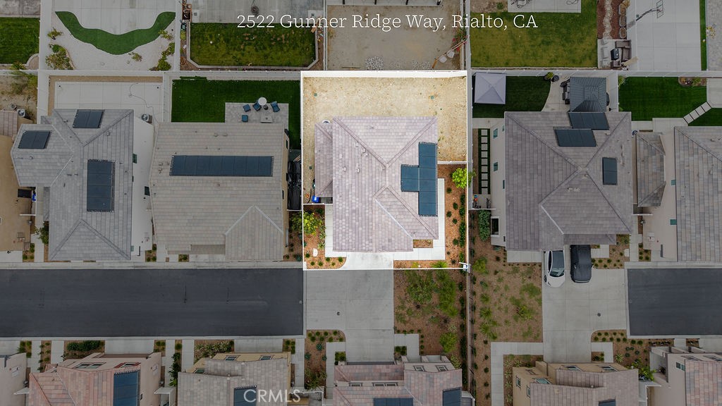 2522 Gunner Ridge Way Rialto, CA 92377 - Photo 27 of 40 an aerial view of residential houses with outdoor space