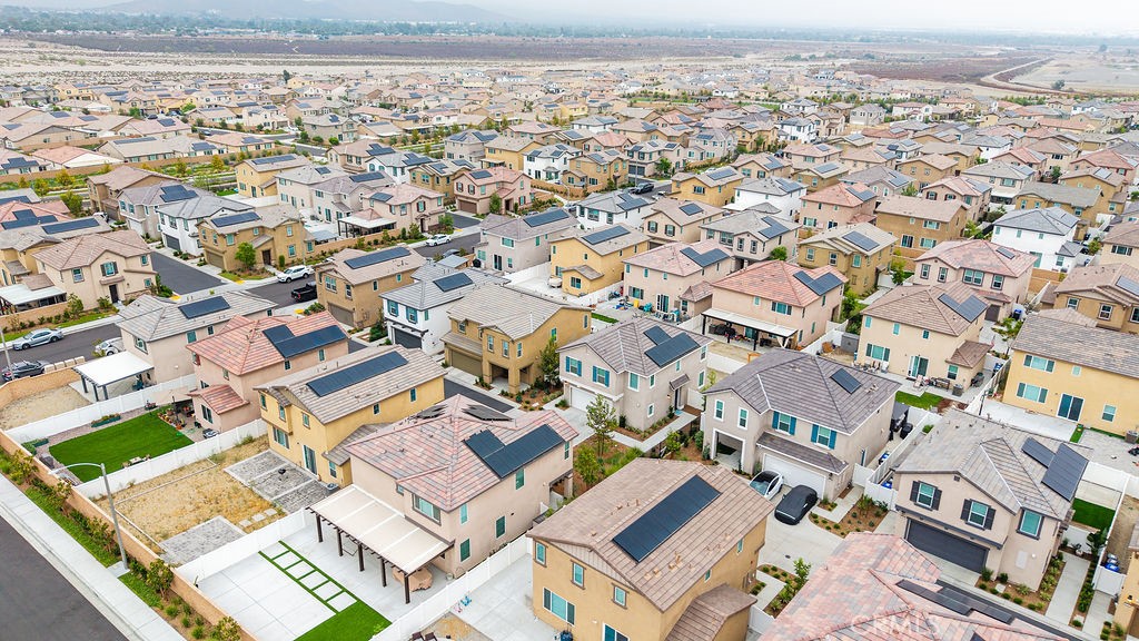 2522 Gunner Ridge Way Rialto, CA 92377 - Photo 28 of 40 an aerial view of residential building with parking