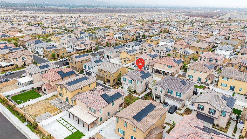 2522 Gunner Ridge Way Rialto, CA 92377 - Photo 29 of 40 an aerial view of residential building with parking