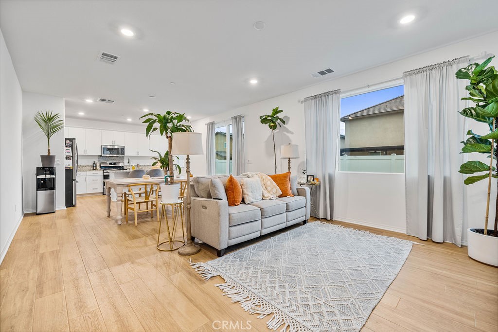 2522 Gunner Ridge Way Rialto, CA 92377 - Photo 5 of 40 a living room with furniture and wooden floor