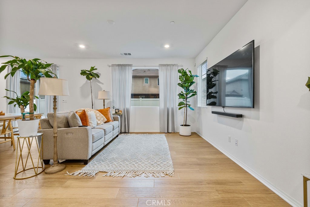 2522 Gunner Ridge Way Rialto, CA 92377 - Photo 10 of 40 a living room with furniture and a flat screen tv