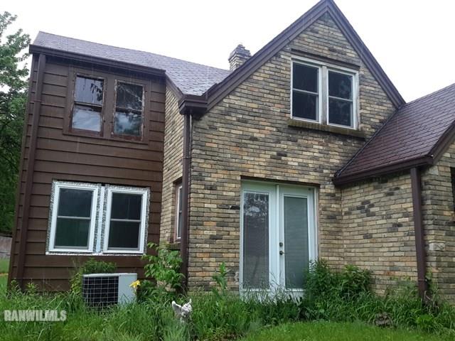 4422 Broadview Road Rockford, IL 61101 - Photo 14 of 25 a front view of a house with a yard