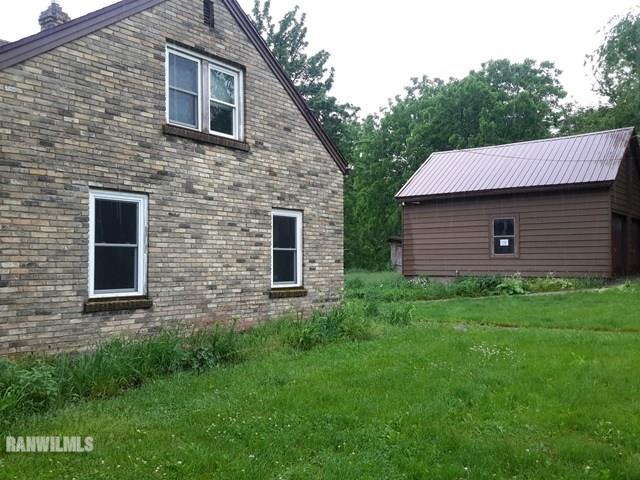 4422 Broadview Road Rockford, IL 61101 - Photo 16 of 25 a view of a house with a yard