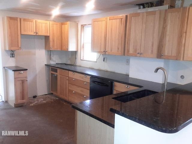 4422 Broadview Road Rockford, IL 61101 - Photo 6 of 25 a kitchen with stainless steel appliances granite countertop a sink a stove and a refrigerator