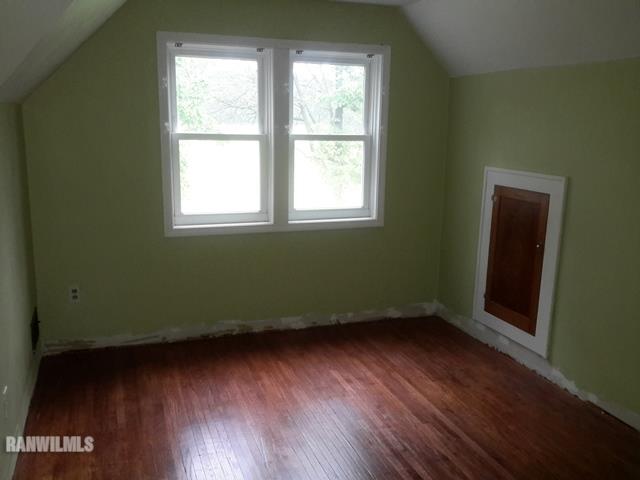 4422 Broadview Road Rockford, IL 61101 - Photo 8 of 25 an empty room with wooden floor and windows