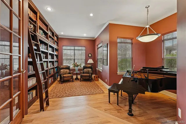 a living room with furniture a rug and a chandelier