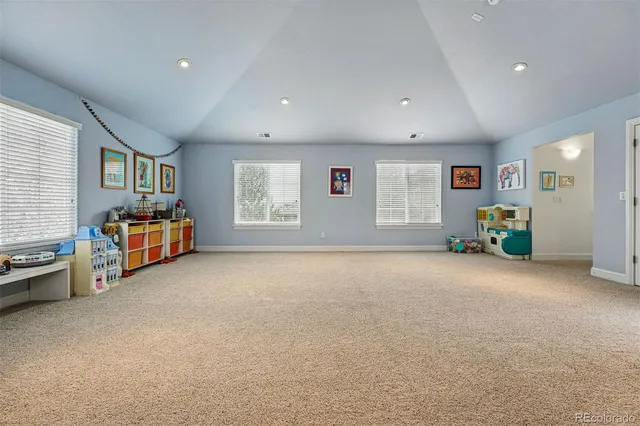 a big room with furniture and window