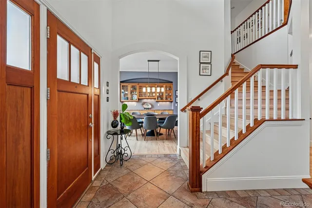 a view of staircase with furniture and a window
