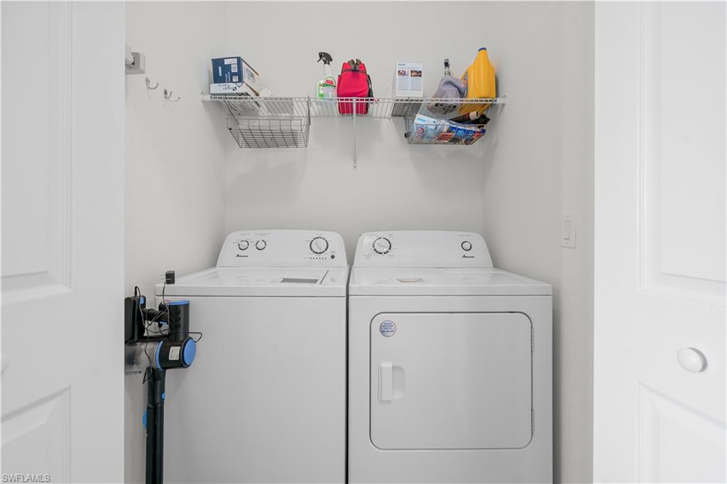 9735 Acqua Court, Unit 641 Naples, FL 34113 - Photo 19 of 34 a utility room with dryer and washer