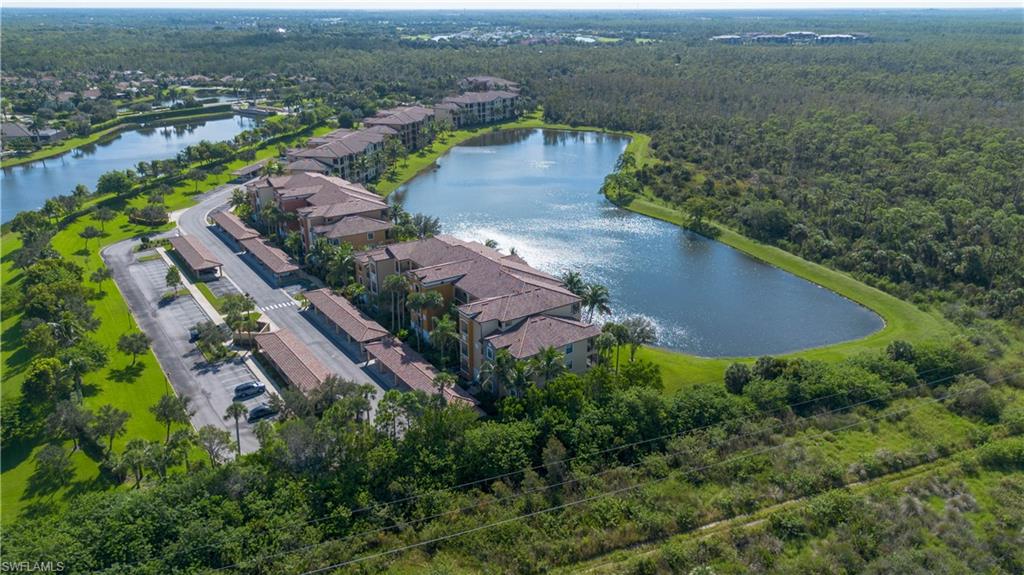 9735 Acqua Court, Unit 641 Naples, FL 34113 - Photo 21 of 34 an aerial view of residential houses with outdoor space and trees