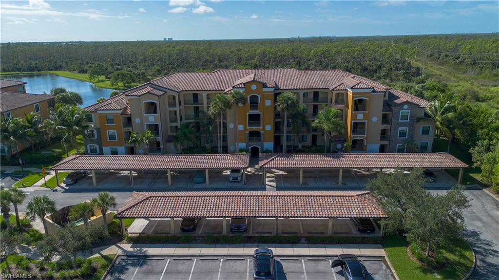 9735 Acqua Court, Unit 641 Naples, FL 34113 - Photo 23 of 34 an aerial view of a house with swimming pool garden and patio
