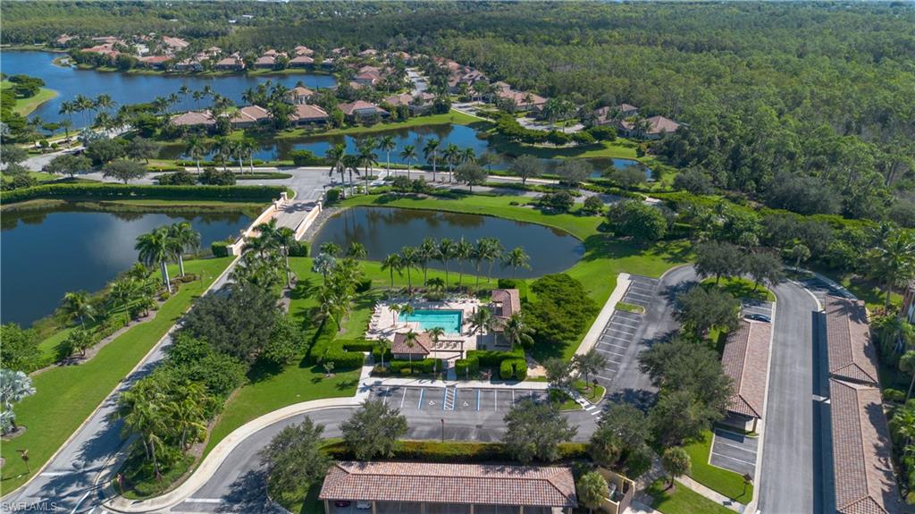 9735 Acqua Court, Unit 641 Naples, FL 34113 - Photo 24 of 34 an aerial view of a house with a garden and lake view