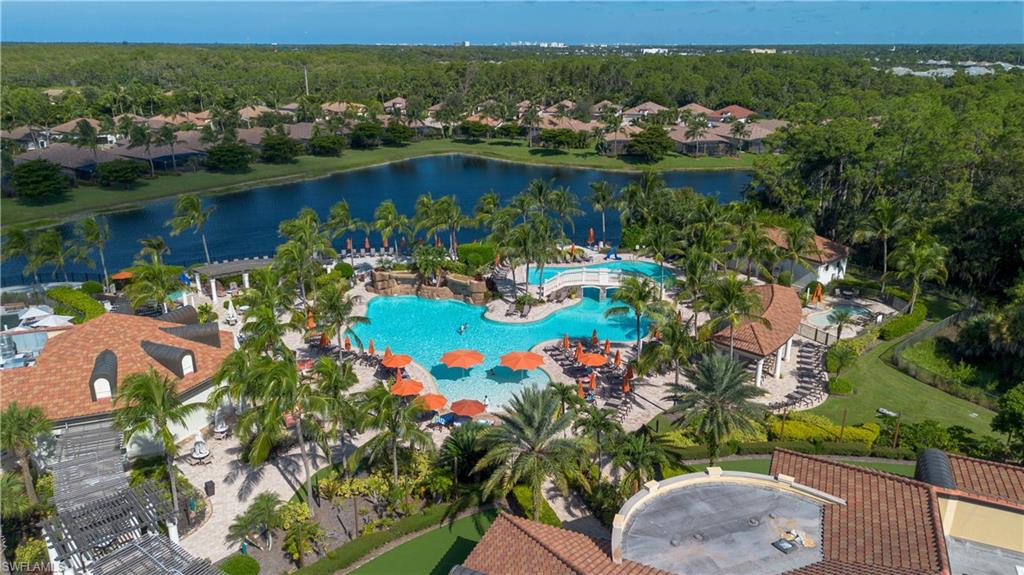 9735 Acqua Court, Unit 641 Naples, FL 34113 - Photo 31 of 34 an aerial view of lake residential house with outdoor space and trees all around