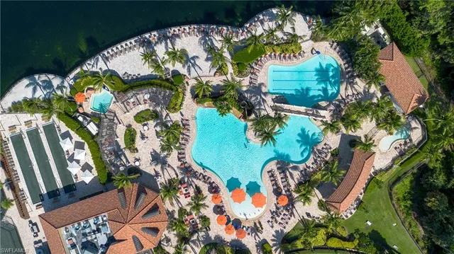 an aerial view of house with yard swimming pool and outdoor seating
