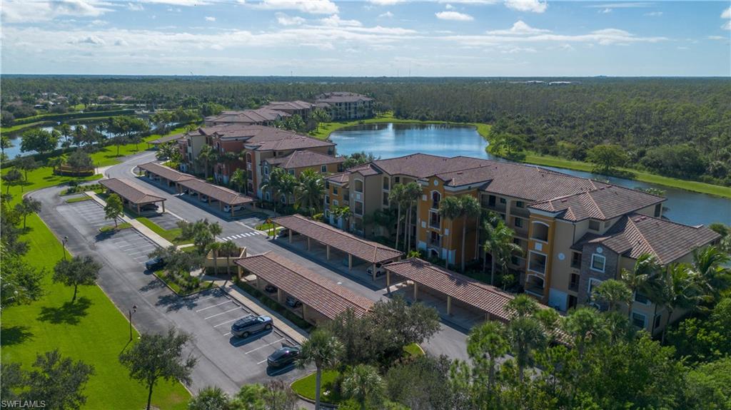 9735 Acqua Court, Unit 641 Naples, FL 34113 - Photo 34 of 34 an aerial view of house with yard swimming pool and outdoor seating