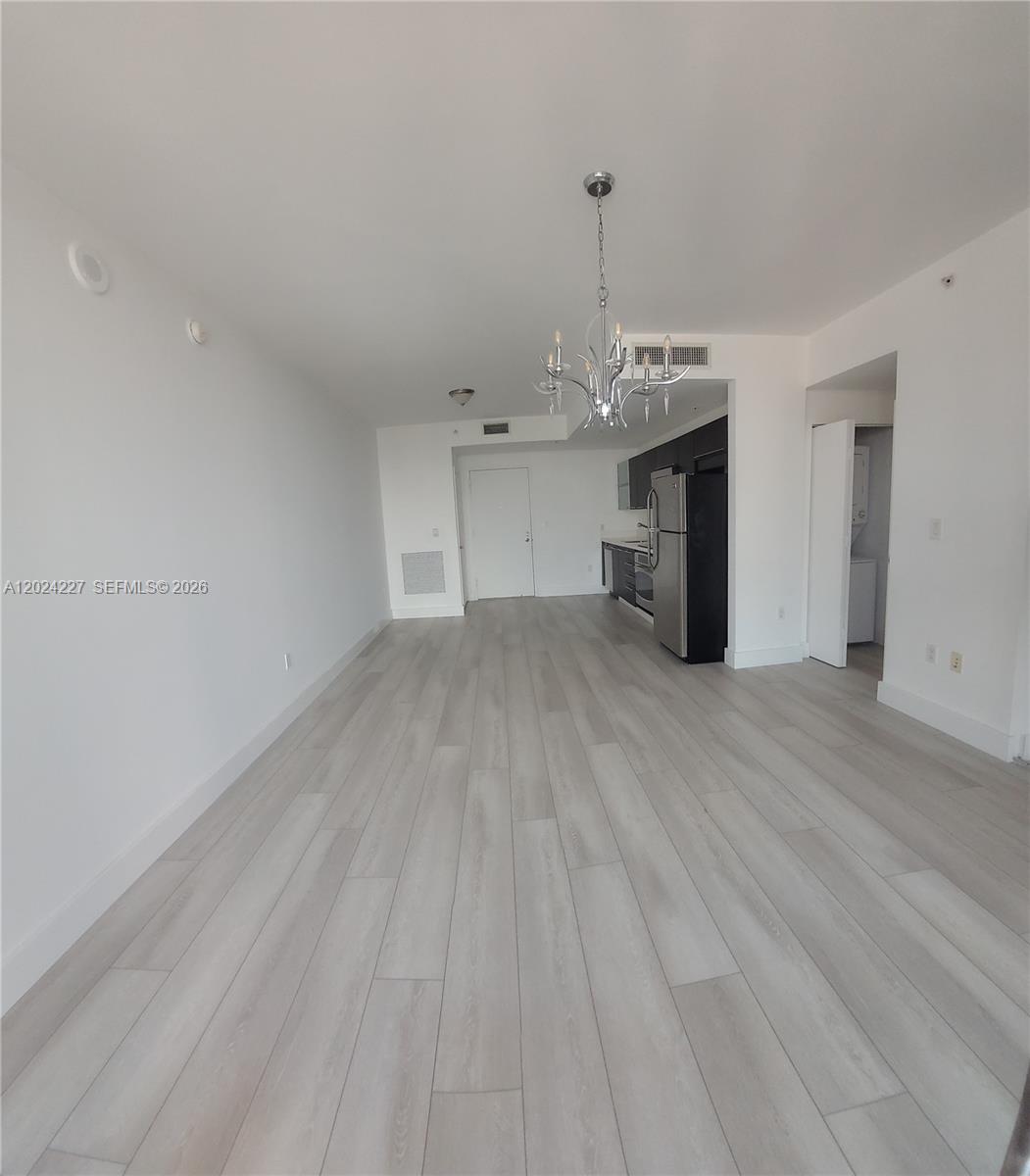 90 Southwest 3rd Street, Unit 2208 Miami, FL 33130 - Photo 11 of 56 a view of a livingroom with a kitchen