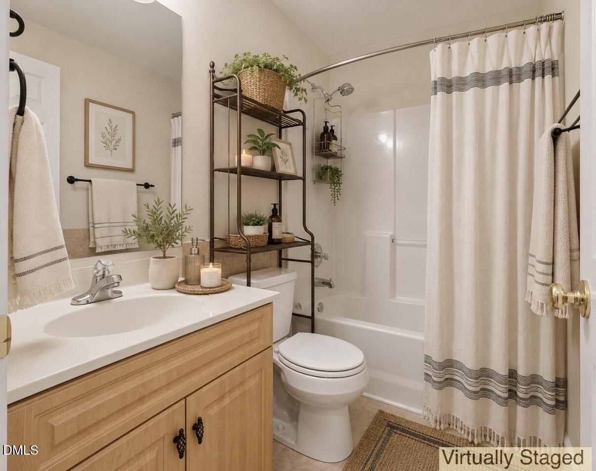 2907 Andover Glen Road Raleigh, NC 27604 - Photo 28 of 39 a bathroom with a sink a toilet and shower