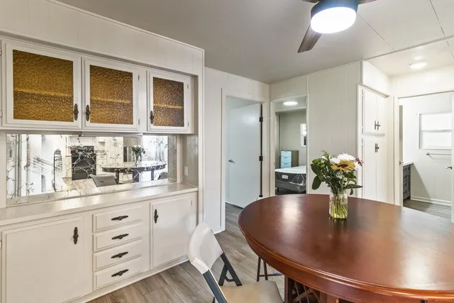 a kitchen with a sink window and refrigerator