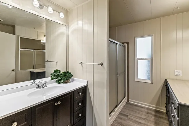 a bathroom with a double vanity sink mirror and double