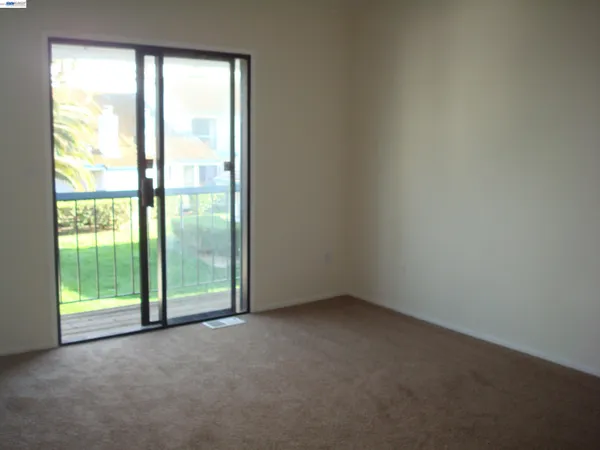 a view of an empty room with a large window