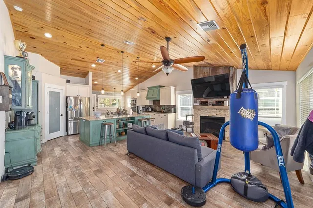 a living room with furniture fireplace and a flat screen tv