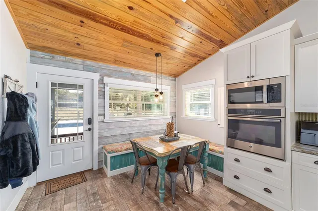 a kitchen with sink cabinets and microwave