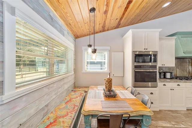 a bedroom with furniture and a flat screen tv