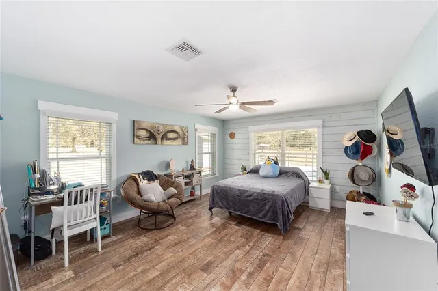 a view of a cabinet and mirror in a bathroom