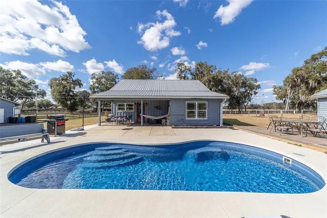 a aerial view of a house with sitting area and garden