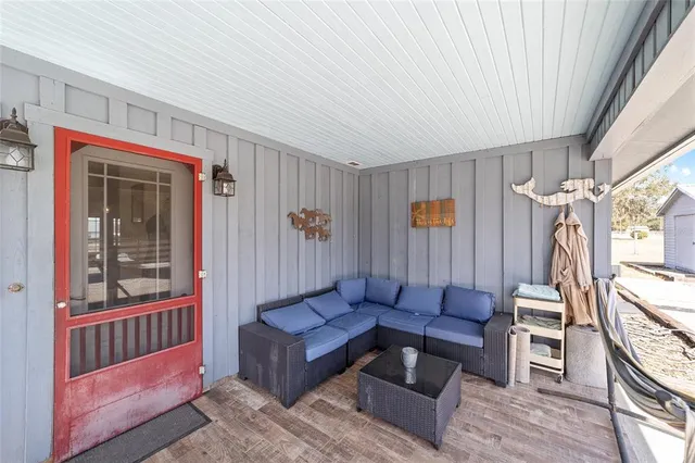 a view of swimming pool with outdoor seating